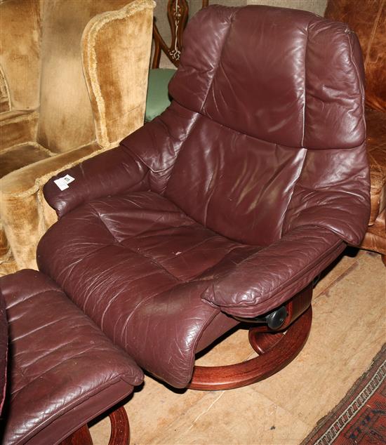 A Moroccan leather swivel reclining chair and stool